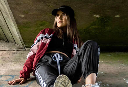 Image of Caoimhe modelling sportwear in an urban setting that links to other sportswear images